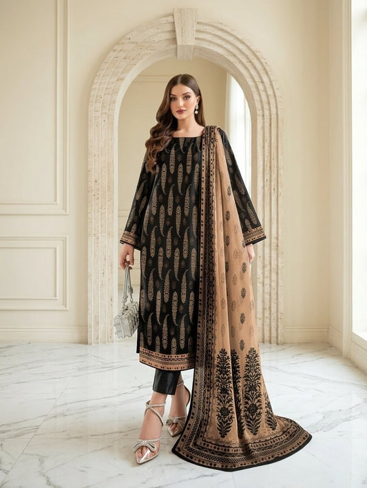 Woman in a black and beige traditional outfit standing in a elegant interior setting.